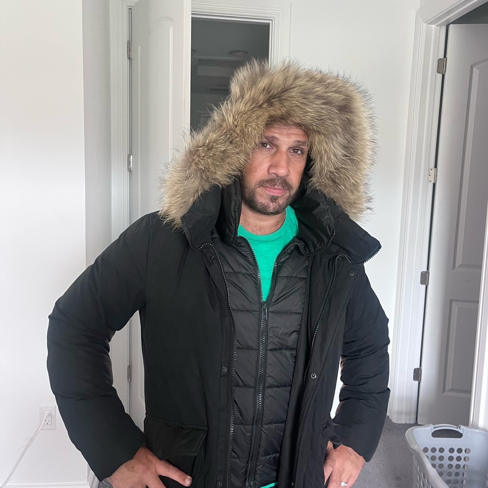 Down men coat, light weight with a real fox fur.